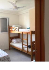 En eller flere senge i et værelse på Apartamento - Residencial Vista Verde