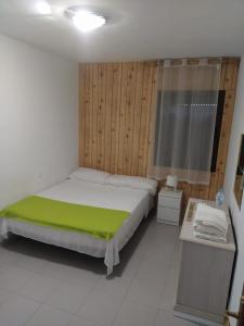 Cama o camas de una habitación en Vivienda compartida Tajaraste