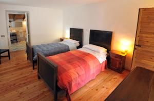 Postel nebo postele na pokoji v ubytování B&B Rocca di Bajedo