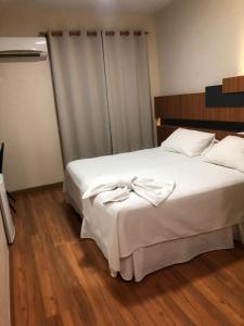 Ένα ή περισσότερα κρεβάτια σε δωμάτιο στο Hotel Aero Park e Estacionamento