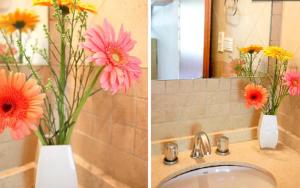 two pictures of flowers in a vase on a sink at Duplex dos ambientes con terraza propia y parilla in Buenos Aires