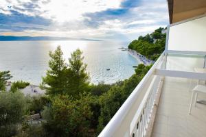 a balcony with a view of the ocean at Villa Gradina in Baška Voda