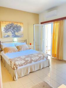 Ένα ή περισσότερα κρεβάτια σε δωμάτιο στο Nautica Hotel