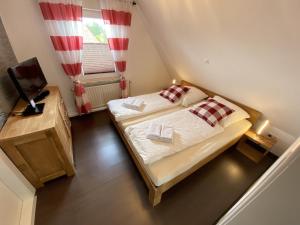 Postel nebo postele na pokoji v ubytování Ferienhaus Weitblick