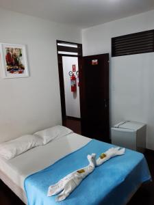 Giường trong phòng chung tại Pousada Portal do Cabo
