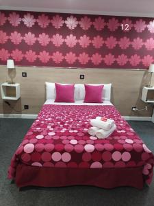 Łóżko lub łóżka w pokoju w obiekcie Hostal Inn Madrid