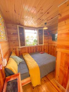 Postel nebo postele na pokoji v ubytování Ziczac Homestay Đà Lạt