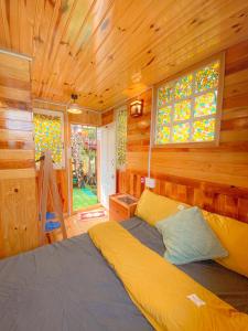 Postel nebo postele na pokoji v ubytování Ziczac Homestay Đà Lạt