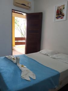 Ένα ή περισσότερα κρεβάτια σε δωμάτιο στο Pousada Portal do Cabo
