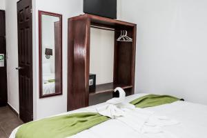 Cama o camas de una habitación en The Palms At Coco Beach