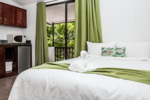 Cama o camas de una habitación en The Palms At Coco Beach