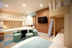 Postel nebo postele na pokoji v ubytování La'gent Hotel Tokyo Bay