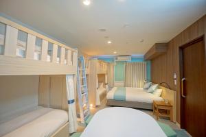 Postel nebo postele na pokoji v ubytování La'gent Hotel Tokyo Bay