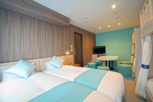 Postel nebo postele na pokoji v ubytování La'gent Hotel Tokyo Bay