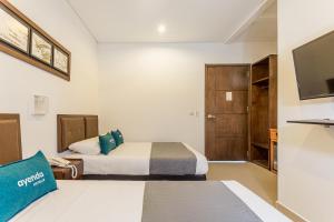 Un pat sau paturi într-o cameră la Hotel Ayenda Boutique Rio Mont
