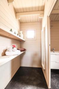 a bathroom with a sink, toilet and bathtub at Mwezi Boutique Resort in Jambiani
