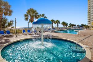 a pool with a water fountain in a resort at Bay Watch 0232 in Myrtle Beach
