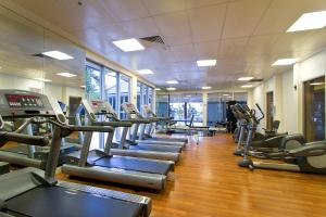a gym with a row of treadmills and machines at Chevron Renaissance - QStay in Gold Coast