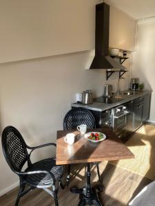 a kitchen with a table and chairs and a stove at NO:4 in Vaasa