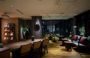 a restaurant with a large table and chairs and tables and tablesktop at GRIDS PREMIUM HOTEL OSAKA NAMBA in Osaka +54 photos