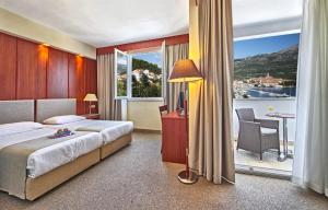 Postel nebo postele na pokoji v ubytování Marko Polo Maradiso Hotel by Aminess