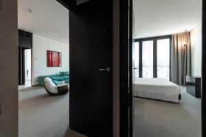 Voodi või voodid majutusasutuse DUPARC Contemporary Suites toas