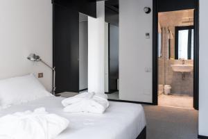 Postel nebo postele na pokoji v ubytování DUPARC Contemporary Suites