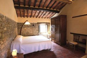 Кровать или кровати в номере La Corte del Falco