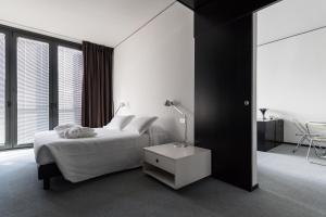 Postel nebo postele na pokoji v ubytování DUPARC Contemporary Suites