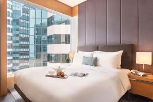 Postel nebo postele na pokoji v ubytování EAST Apartments + 11 fotografií