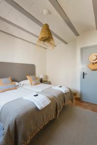 a bedroom with a bed with towels on it at Casa Rural Sansaba in Seville