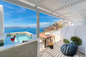 a villa with a view of the ocean at Iriana Suites in Fira