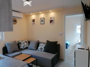 a living room with a couch and a table at ApartDomek CICHE in Zbiczno