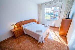 Postel nebo postele na pokoji v ubytování HomeHolidaysRentals Charme - Costa Barcelona