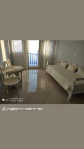 Cama ou camas em um quarto em Mykonos Rooms