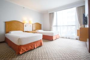 Postel nebo postele na pokoji v ubytování The Linden Suites