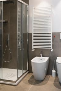 a bathroom with a shower and a sink and a toilet at La Locanda dei Cavalieri Country House in Civitanova Marche +41 photos