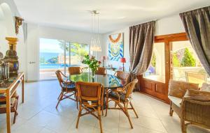 a living room with a dining room table and chairs at La Galesa in Jávea