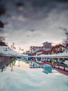 a view of a snow covered city with a bridge at Vamoose Mudra Midtown in Kalasa