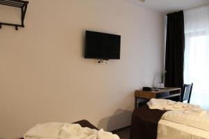 TV a/nebo společenská místnost v ubytování Hotel Parang + 18 fotografií