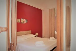 Postel nebo postele na pokoji v ubytování MAKANI APARTMENTS - San Vito Lo Capo