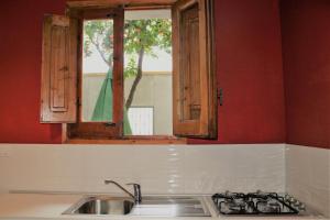 Kuchyň nebo kuchyňský kout v ubytování MAKANI APARTMENTS - San Vito Lo Capo