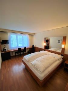 Säng eller sängar i ett rum på Hotel Arte Spreitenbach
