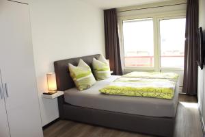 Un pat sau paturi într-o cameră la Appartement Amelanderoase 83 im Amelander Paradijs