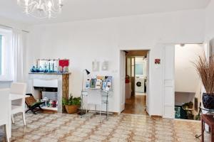 a living room with a fireplace and a refrigerator at Le Viole Matte - Appartamento immerso nel Verde con Vista Mare in La Spezia