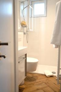 Ett badrum på Studio-Apartment Piccolino 26