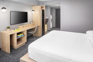 Säng eller sängar i ett rum på Henn na Hotel New York