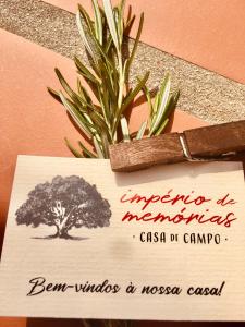 a card with a tree and a knife on it at Imperio de Memorias - Casa de Campo in Vale Bordalo
