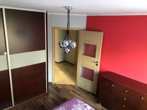 Posteľ alebo postele v izbe v ubytovaní Apartament Tuwima