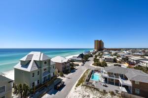 an aerial view of a beach with houses and the ocean at Commodore Resort #707 by Book That Condo in Panama City Beach
